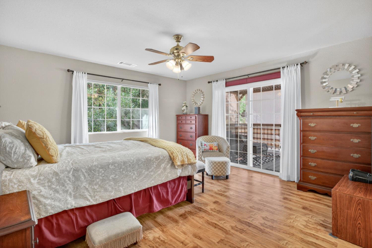 4856 Kiva Drive Copperopolis, CA 95228 - Photo 19 of 61 a spacious bedroom with a bed and wooden floor