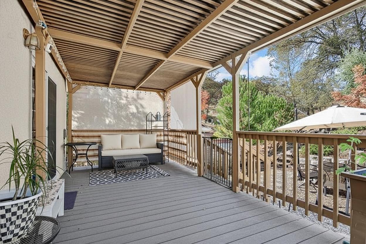 4856 Kiva Drive Copperopolis, CA 95228 - Photo 20 of 61 a view of a balcony with chairs and wooden floor