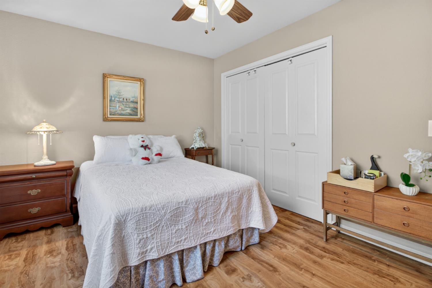 4856 Kiva Drive Copperopolis, CA 95228 - Photo 28 of 61 a bedroom with a bed and a chandelier