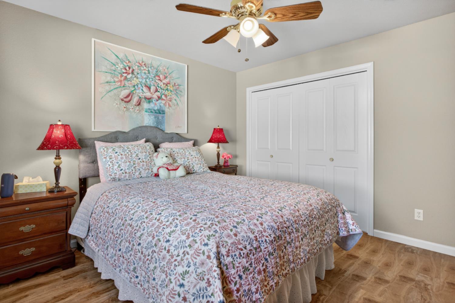 4856 Kiva Drive Copperopolis, CA 95228 - Photo 31 of 61 a bedroom with a bed and a chandelier