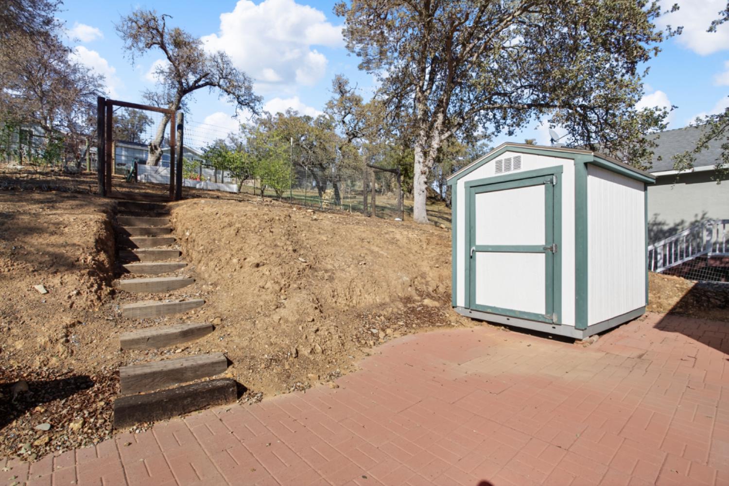 4856 Kiva Drive Copperopolis, CA 95228 - Photo 53 of 61 a front view of a house with large trees