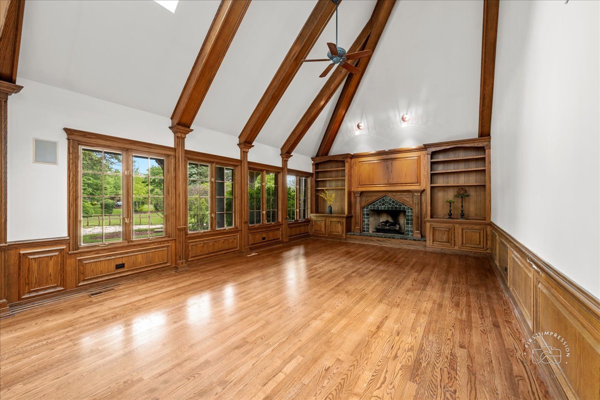 5N214 Wilton Croft Road St. Charles, IL 60175 - Photo 12 of 37 a view of empty room with wooden floor and fireplace