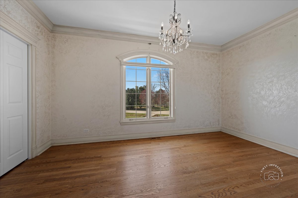 5N214 Wilton Croft Road St. Charles, IL 60175 - Photo 19 of 37 a view of an empty room with wooden floor and a window