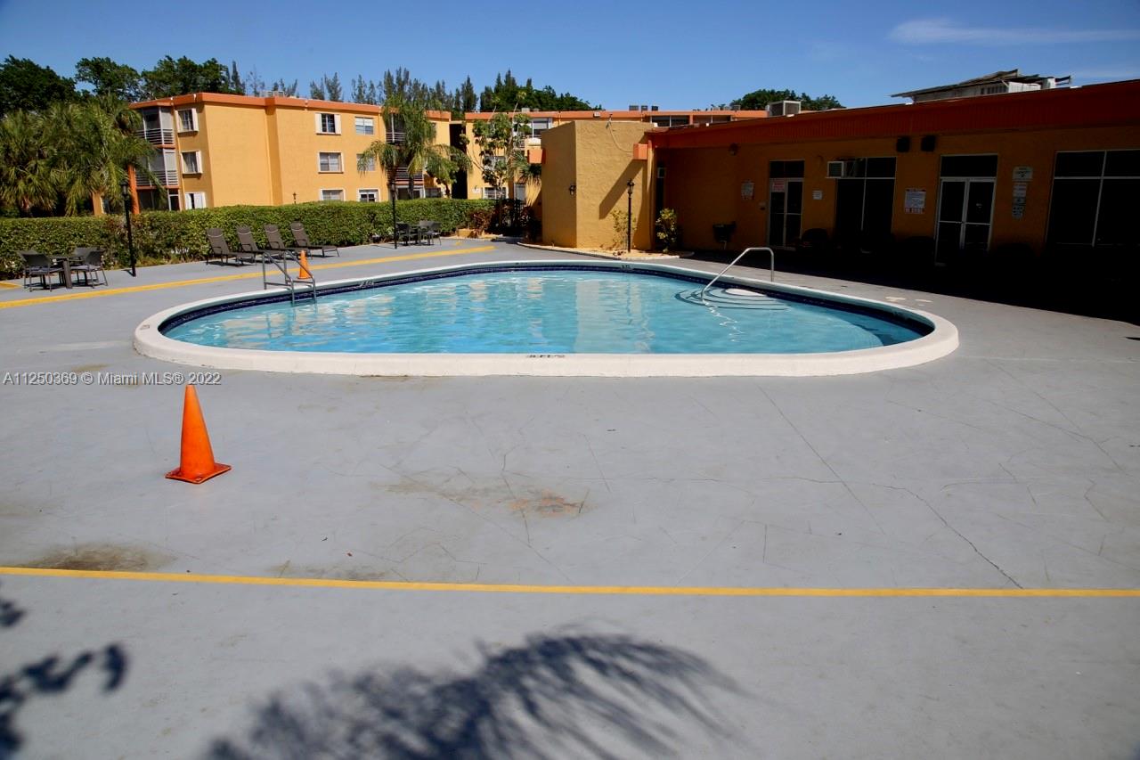 a view of outdoor space and swimming pool
