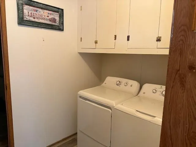 a view of a house with a tree in front of it