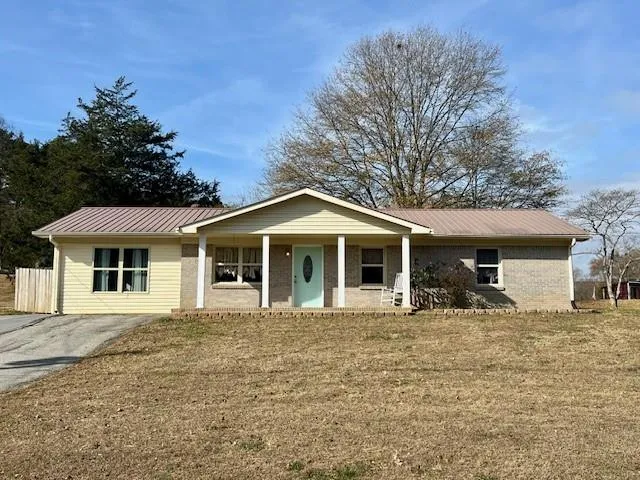 a front view of a house with yard