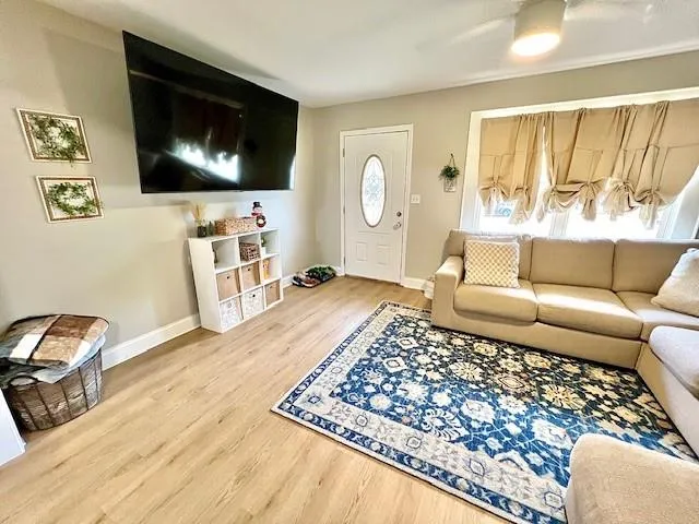 a living room with a couch and a flat screen tv