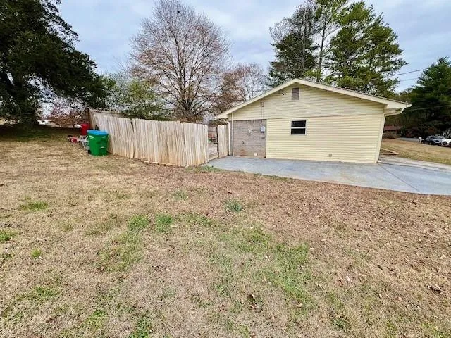 a view of a house with a yard and garage