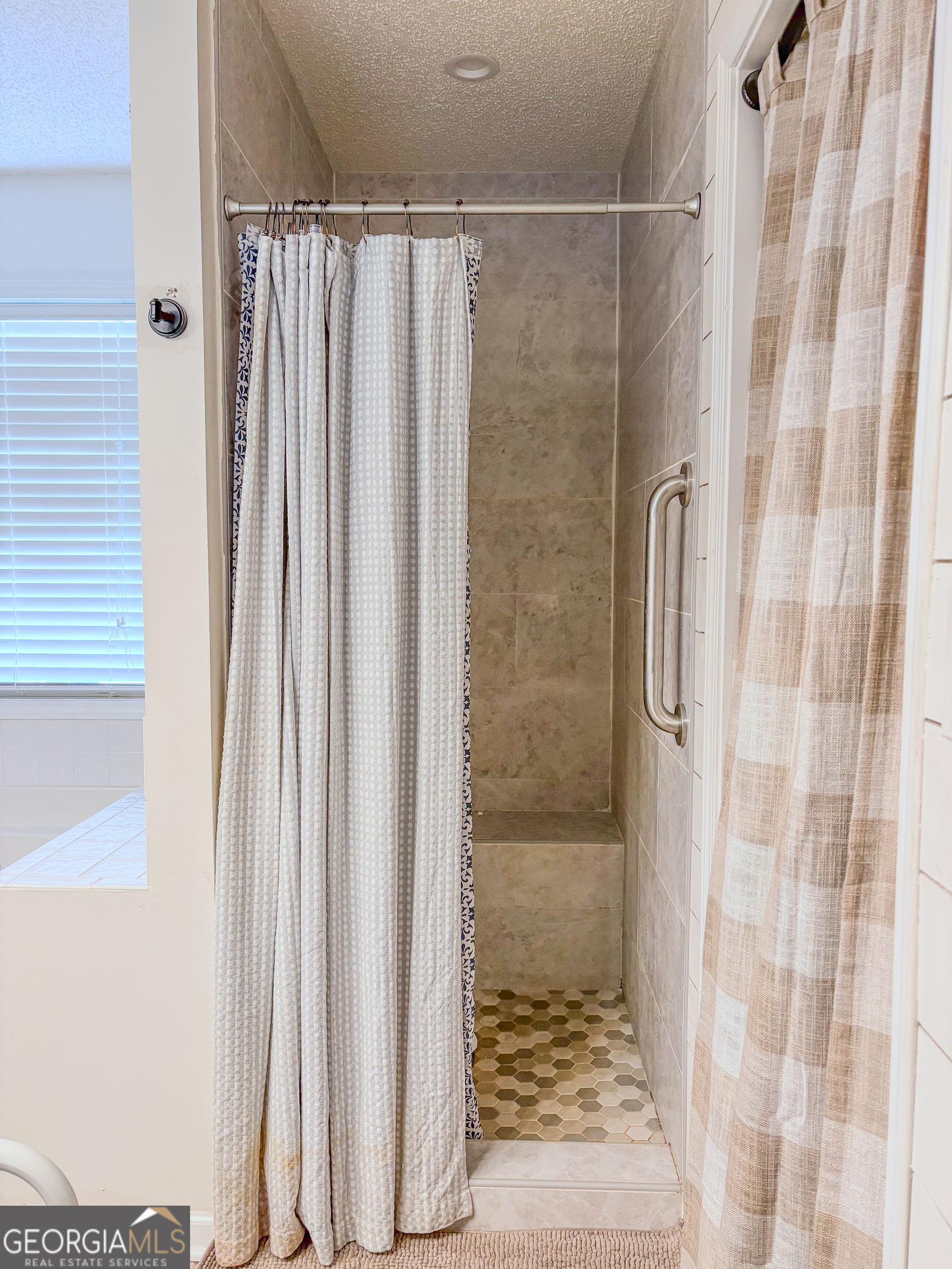 408 Mosby Lane Locust Grove, GA 30248 - Photo 11 of 17 a bathroom with a shower and a window
