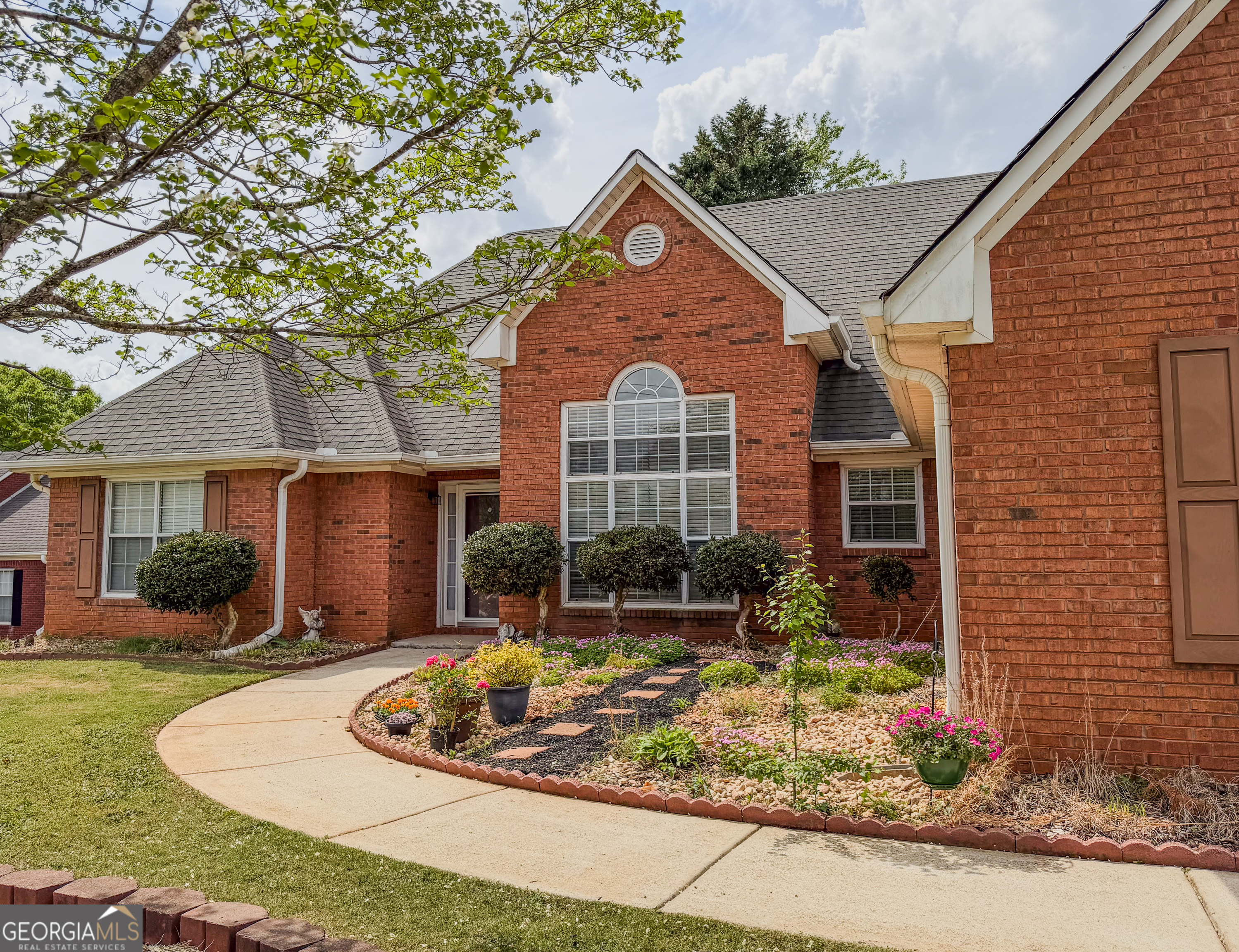 408 Mosby Lane Locust Grove, GA 30248 - Photo 2 of 17 a front view of a house with entertaining space
