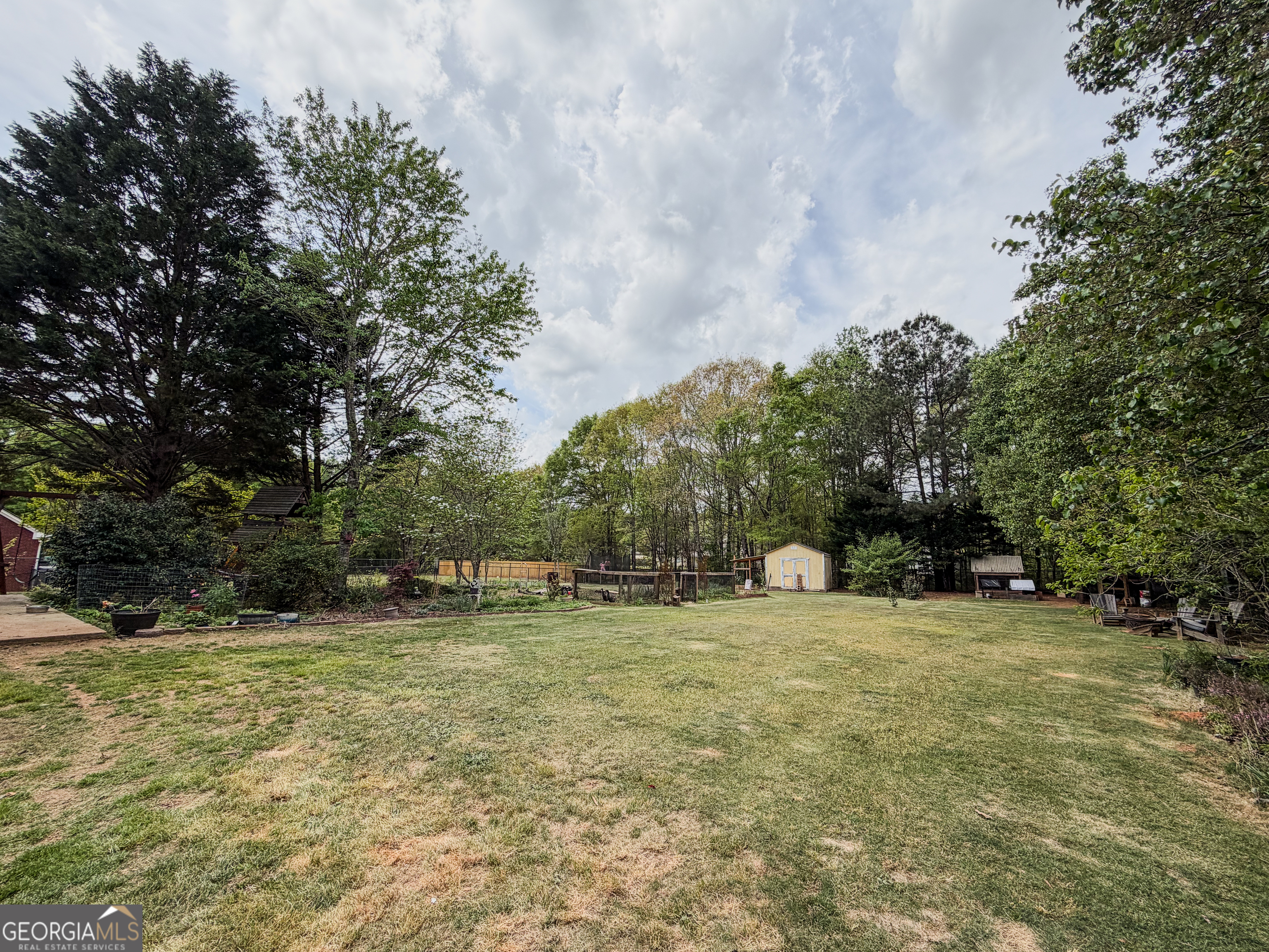408 Mosby Lane Locust Grove, GA 30248 - Photo 3 of 17 a view of outdoor space with trees all around