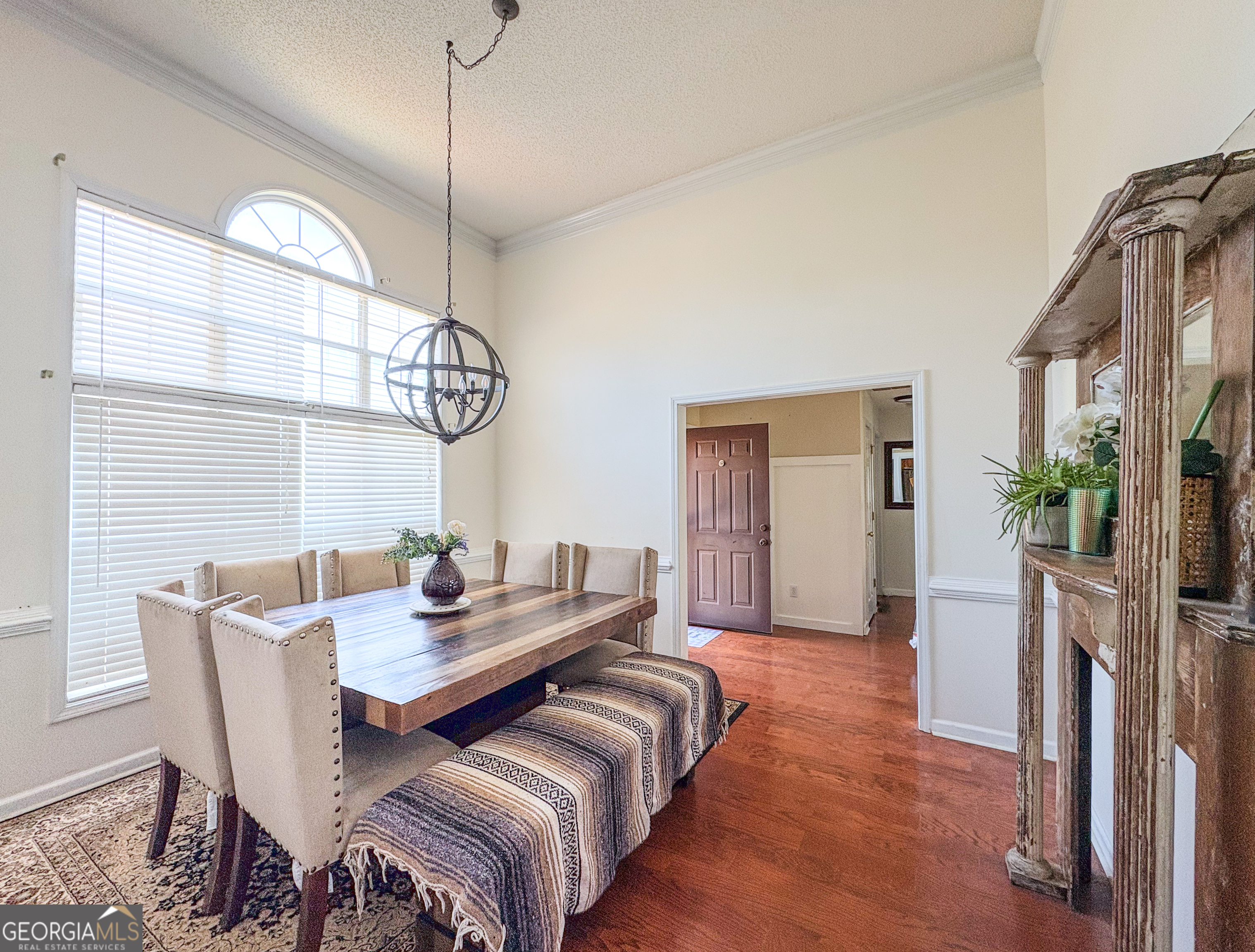 408 Mosby Lane Locust Grove, GA 30248 - Photo 6 of 17 a bedroom with a bed and a chandelier