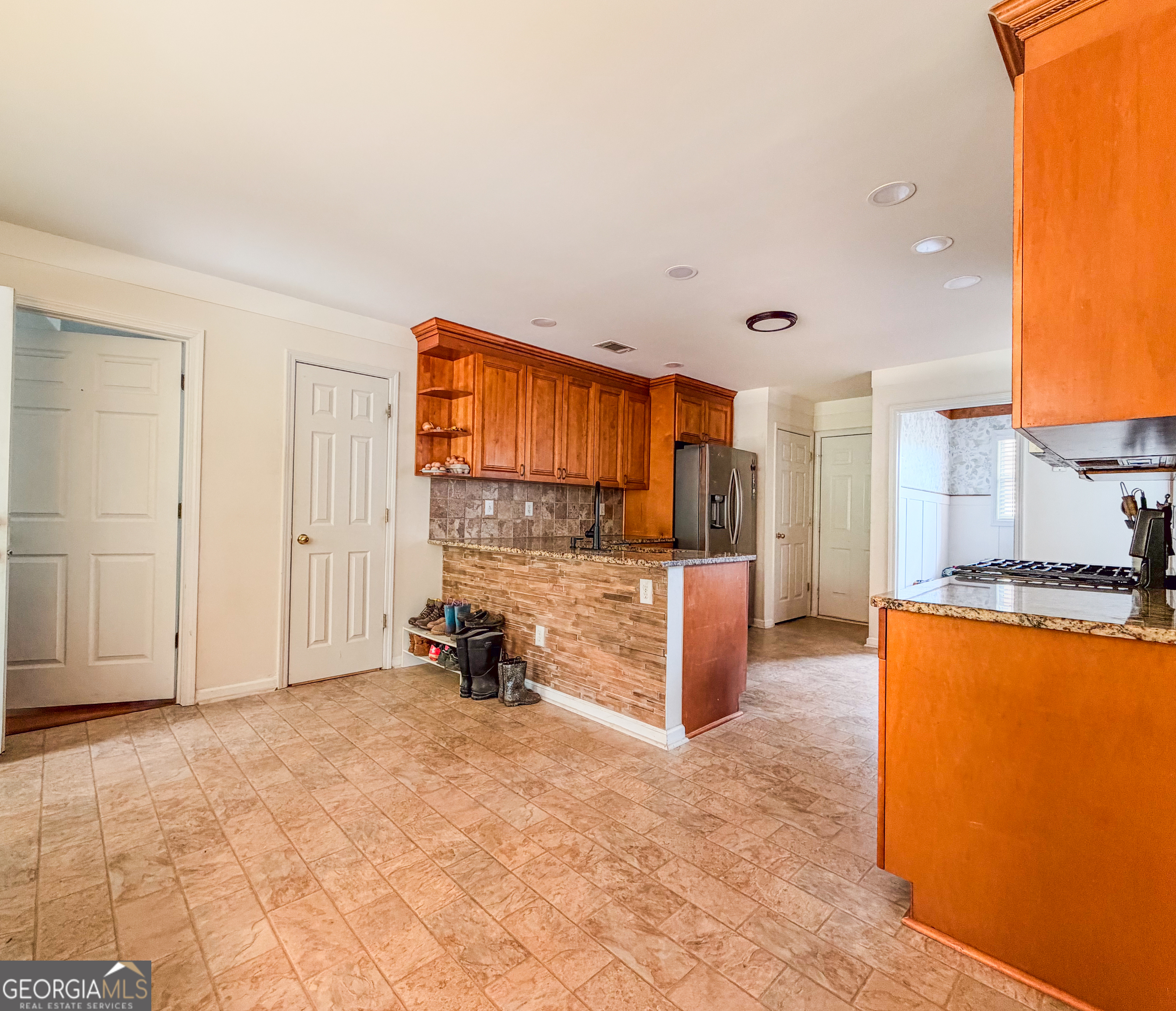 408 Mosby Lane Locust Grove, GA 30248 - Photo 8 of 17 a view of a kitchen with a sink and a refrigerator