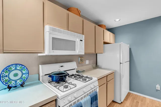 a kitchen with a stove and a microwave