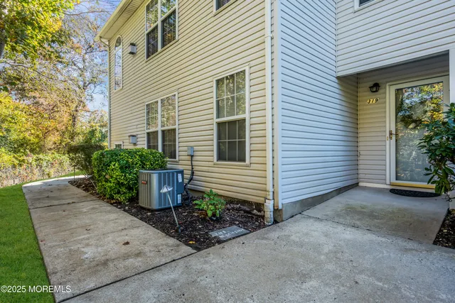 a view of a house with potted plants