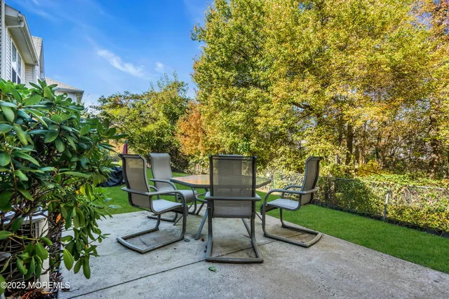 a view of a chairs and table in the garden