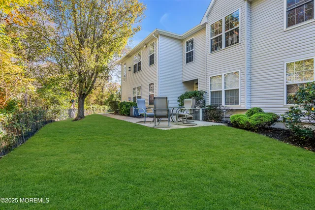 a house view with a sitting space and garden