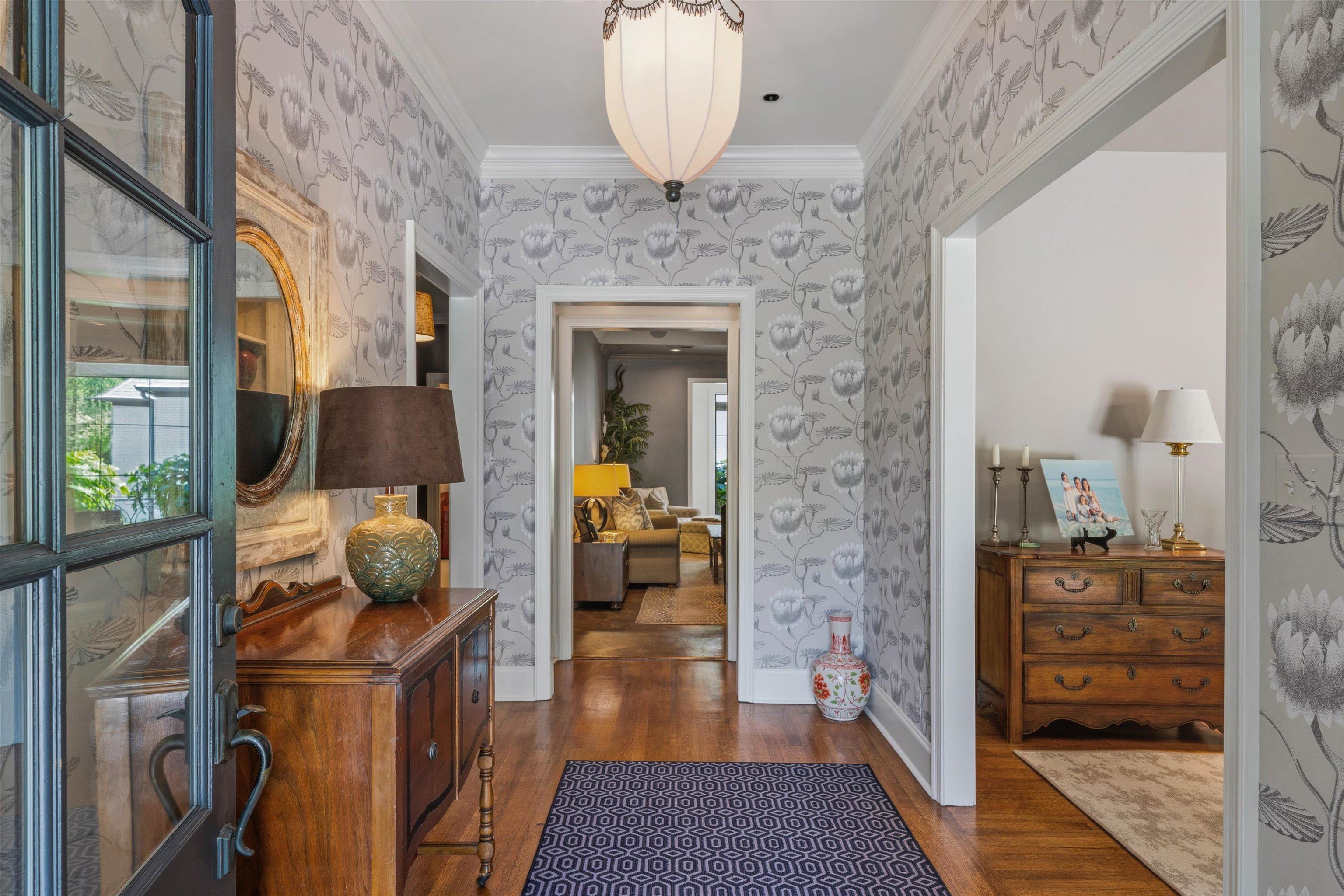 4710 Gwynne Road Memphis, TN 38117 - Photo 5 of 40 a hallway with a stove a dining table and chairs