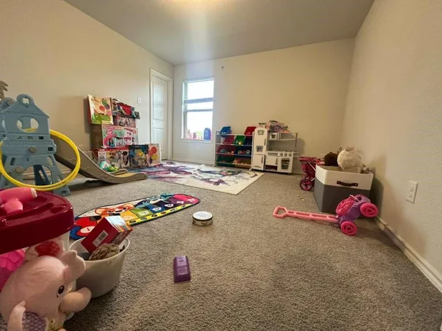 a kids room with toys and toys