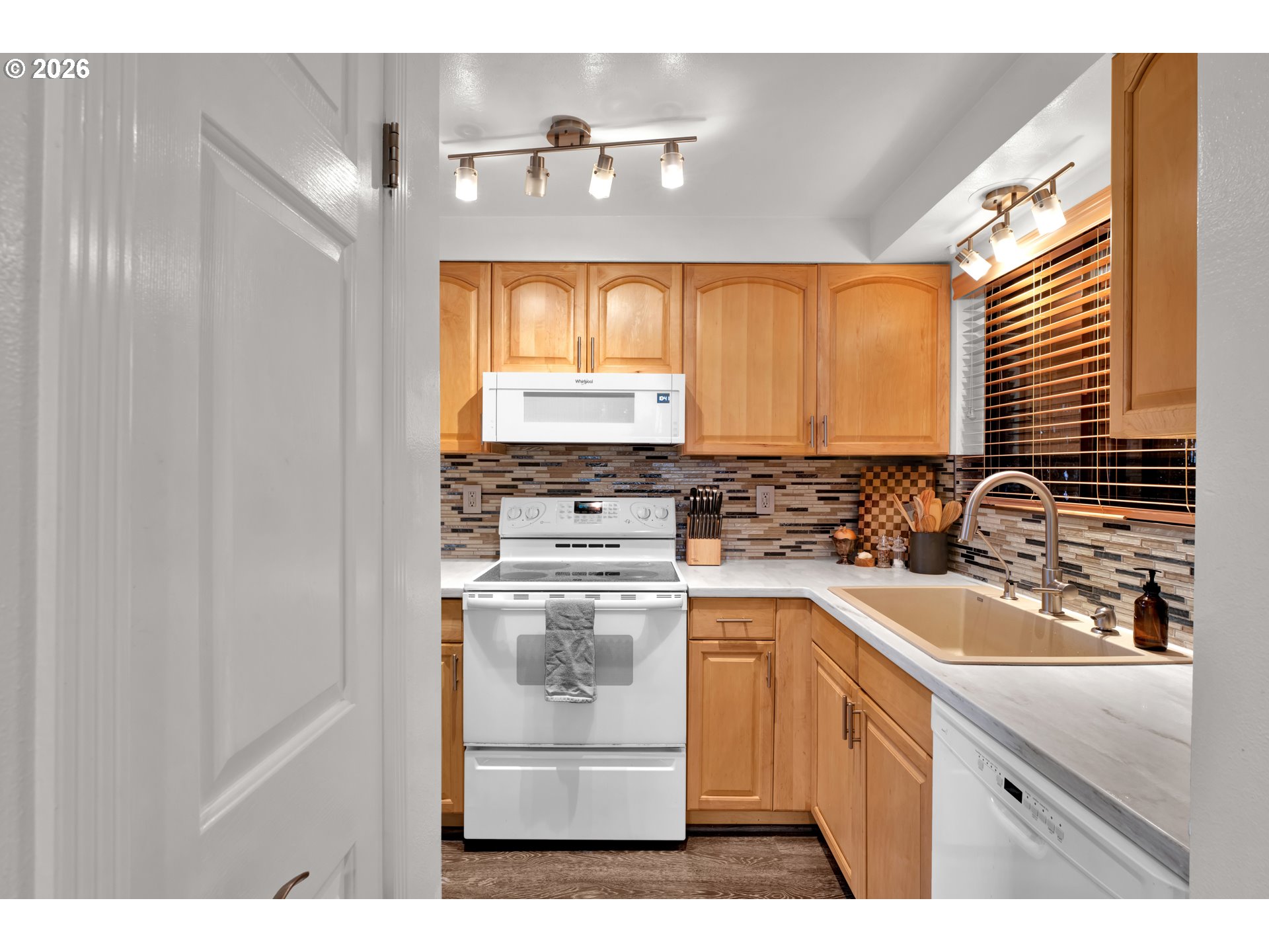 126 Treehill Loop Eugene, OR 97405 - Photo 12 of 35 a kitchen with a sink cabinets stainless steel appliances and a window