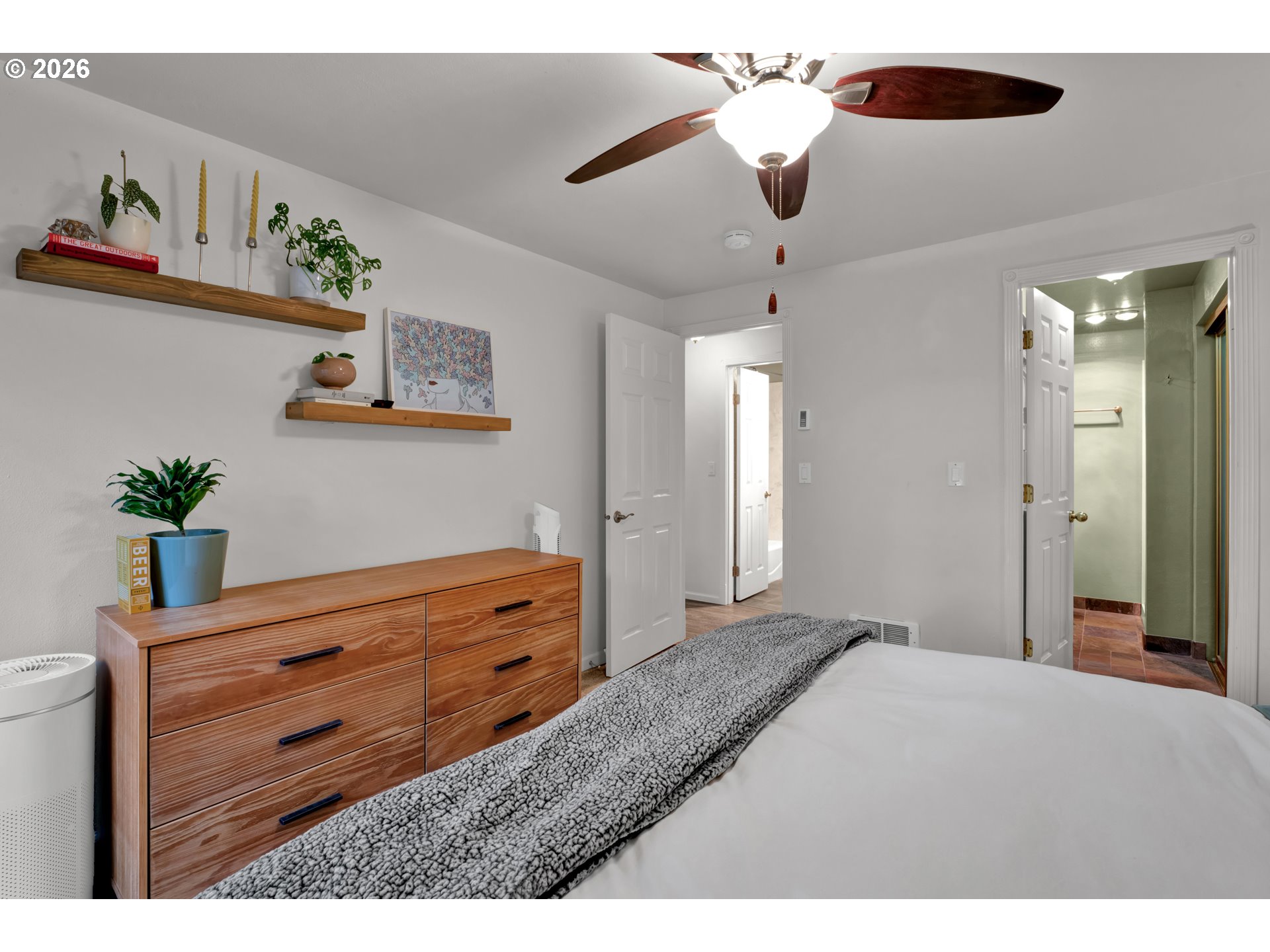 126 Treehill Loop Eugene, OR 97405 - Photo 19 of 35 a bedroom with a bed and a chandelier fan