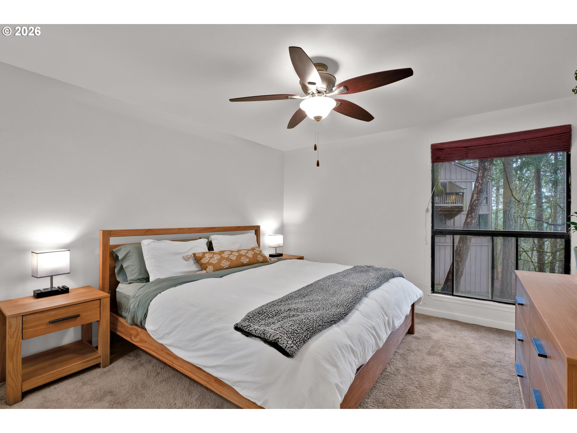 126 Treehill Loop Eugene, OR 97405 - Photo 20 of 35 a bedroom with a large bed and a chandelier