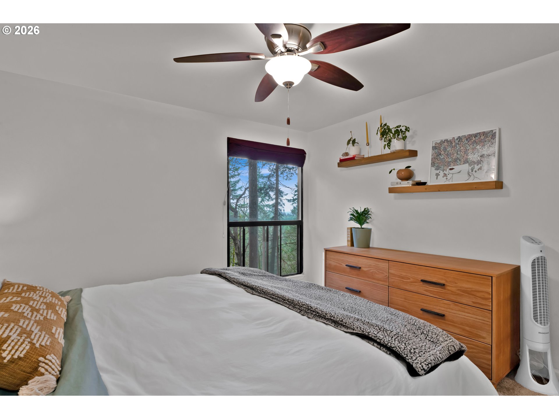 126 Treehill Loop Eugene, OR 97405 - Photo 21 of 35 a bedroom with a large bed and a chandelier