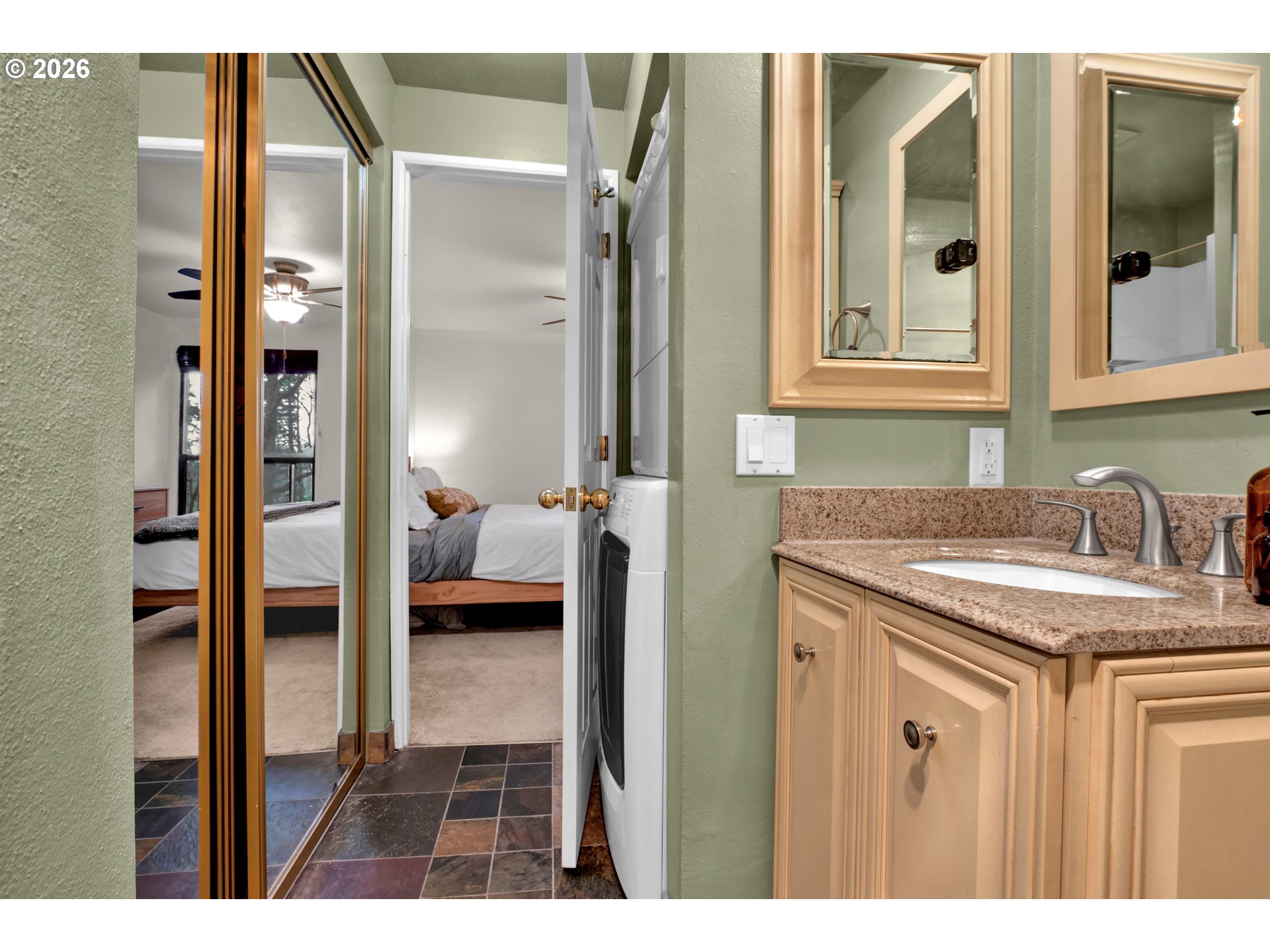 126 Treehill Loop Eugene, OR 97405 - Photo 25 of 35 a en suite bathroom with a granite countertop sink and a mirror