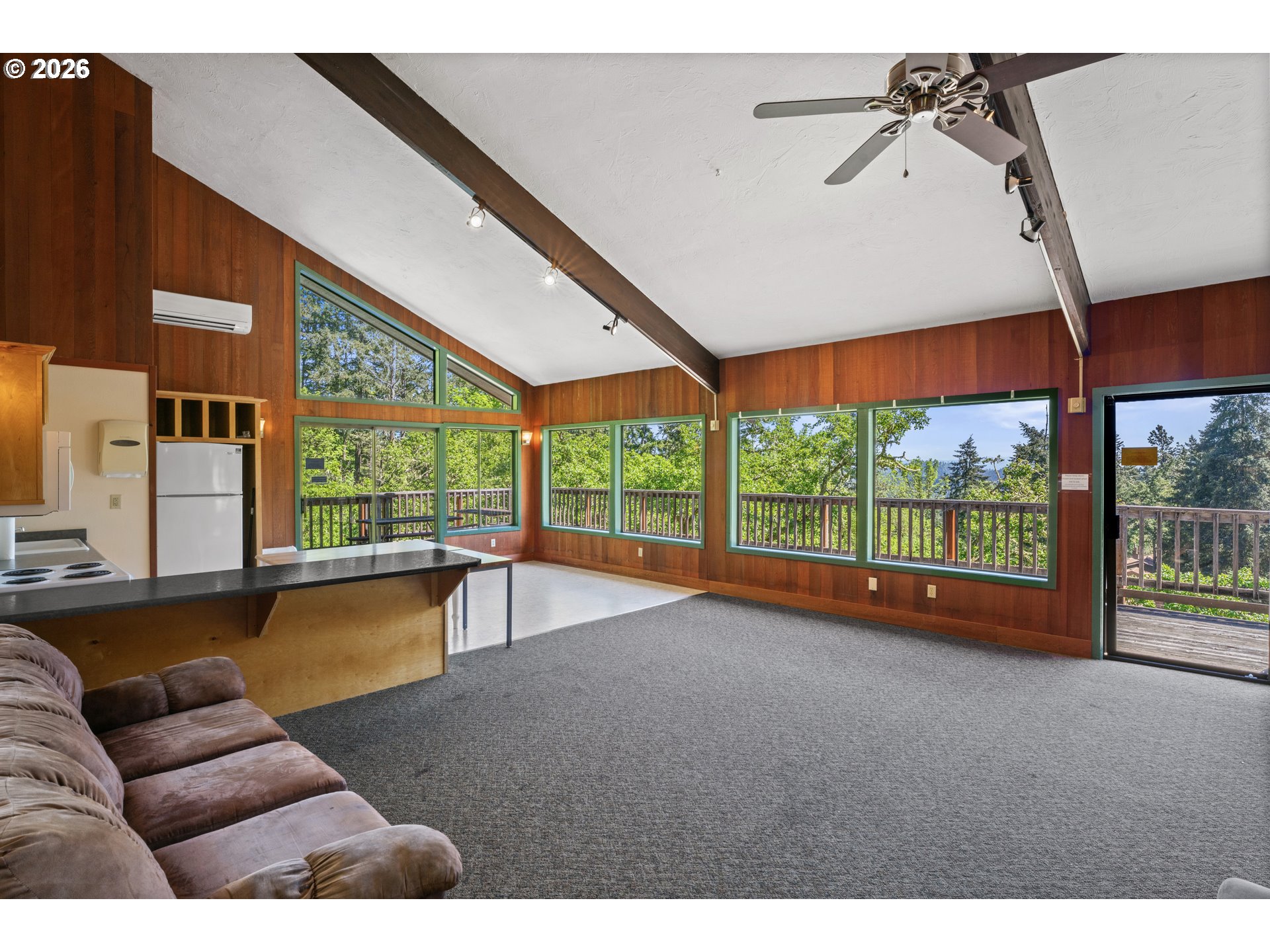 126 Treehill Loop Eugene, OR 97405 - Photo 30 of 35 a living room with furniture and large windows