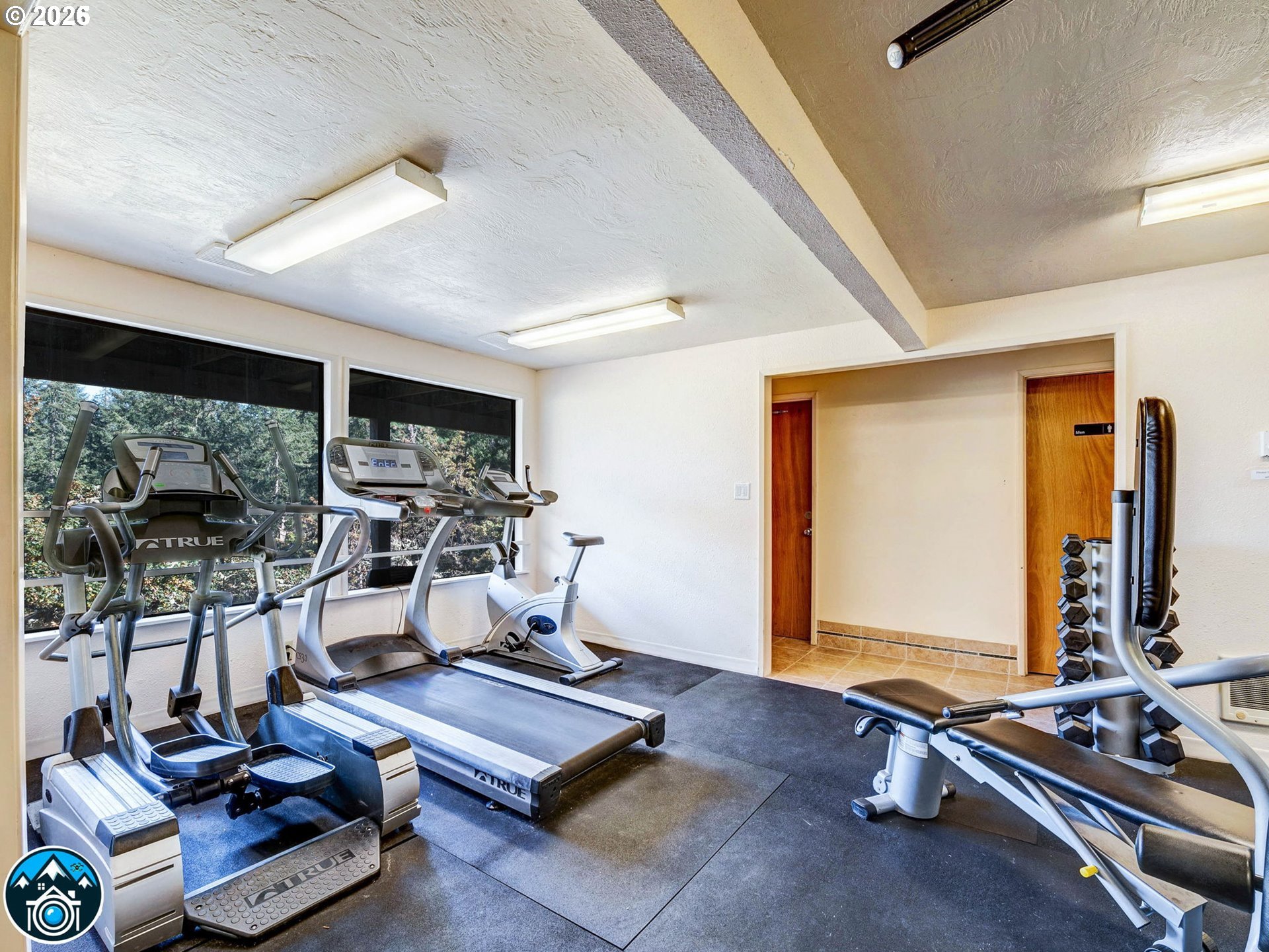 126 Treehill Loop Eugene, OR 97405 - Photo 31 of 35 a living room with furniture a flat screen tv and a large window