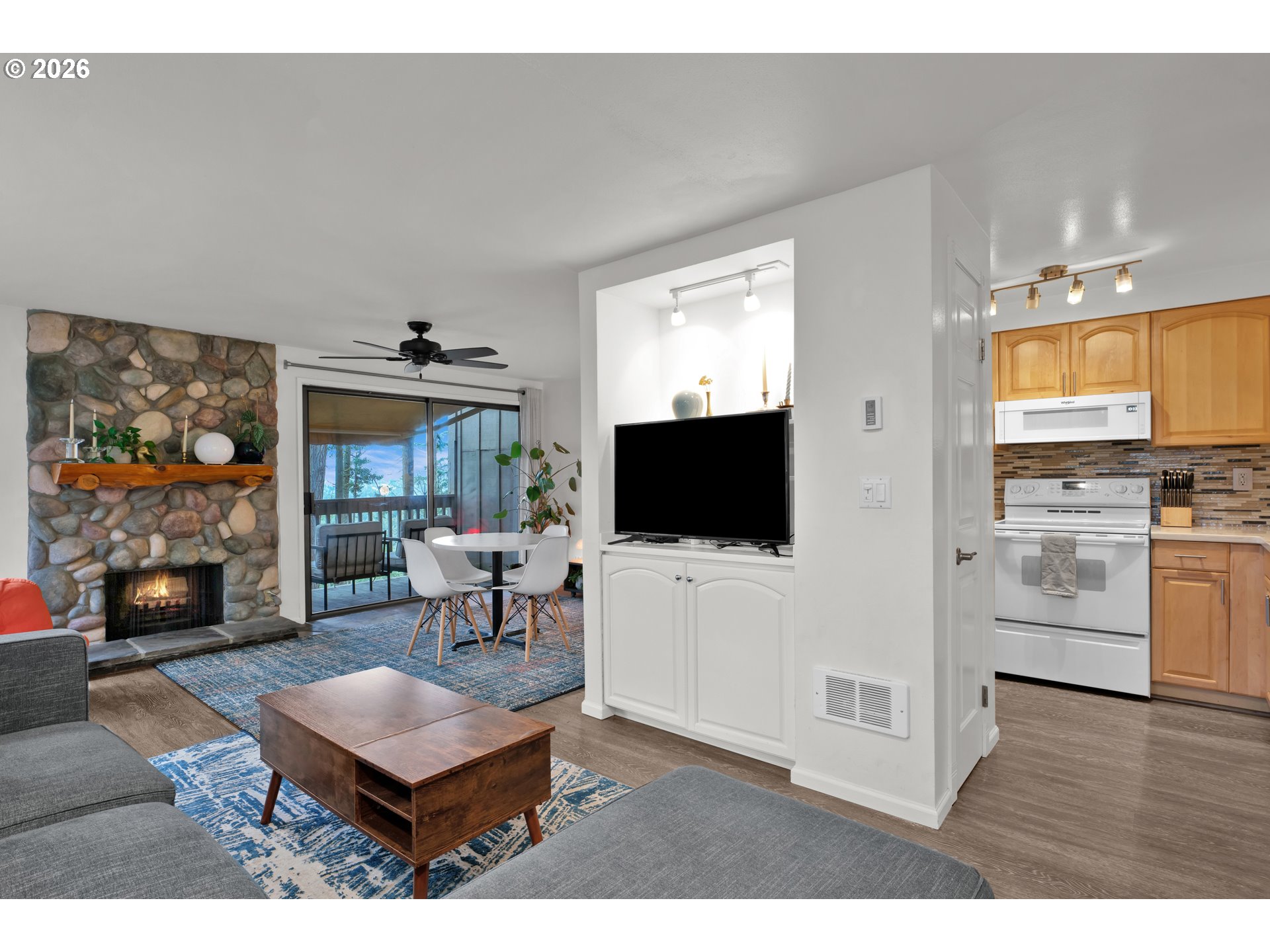 126 Treehill Loop Eugene, OR 97405 - Photo 7 of 35 a living room with furniture and a flat screen tv