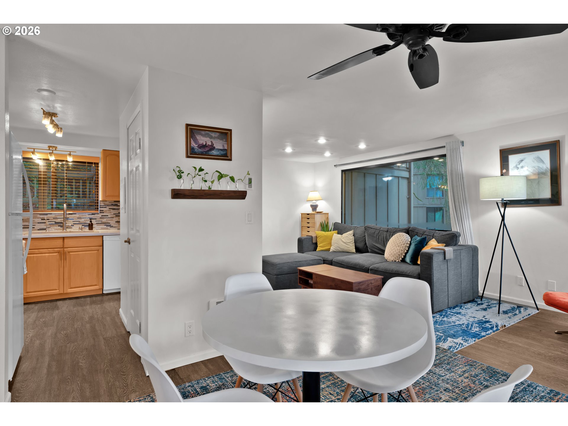 126 Treehill Loop Eugene, OR 97405 - Photo 8 of 35 a living room with couches and kitchen view with wooden floor