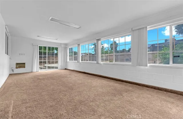 a view of an empty room with a large window