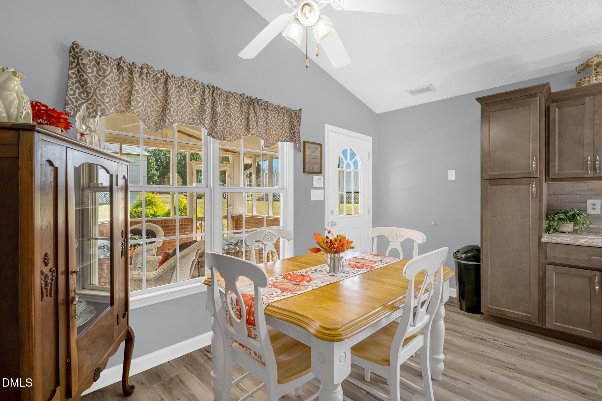 5626 Preston Loop Mebane, NC 27302 - Photo 11 of 33 a view of a dining room with furniture window and wooden floor