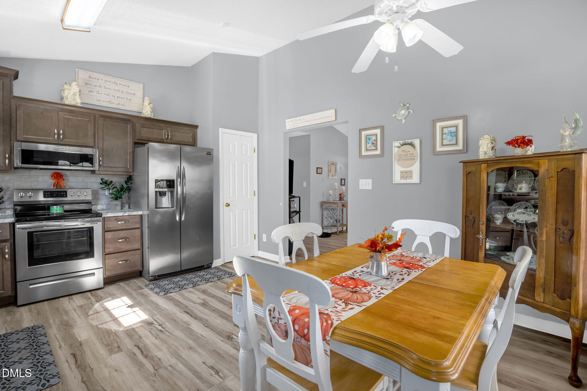 5626 Preston Loop Mebane, NC 27302 - Photo 12 of 33 a living room with stainless steel appliances kitchen island granite countertop furniture and a kitchen view