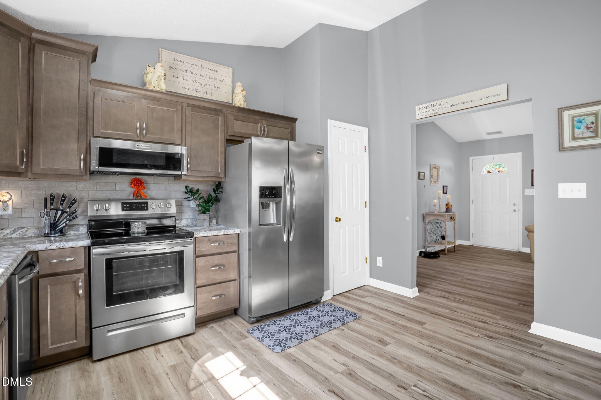 5626 Preston Loop Mebane, NC 27302 - Photo 15 of 33 a kitchen with stainless steel appliances granite countertop a refrigerator stove and sink
