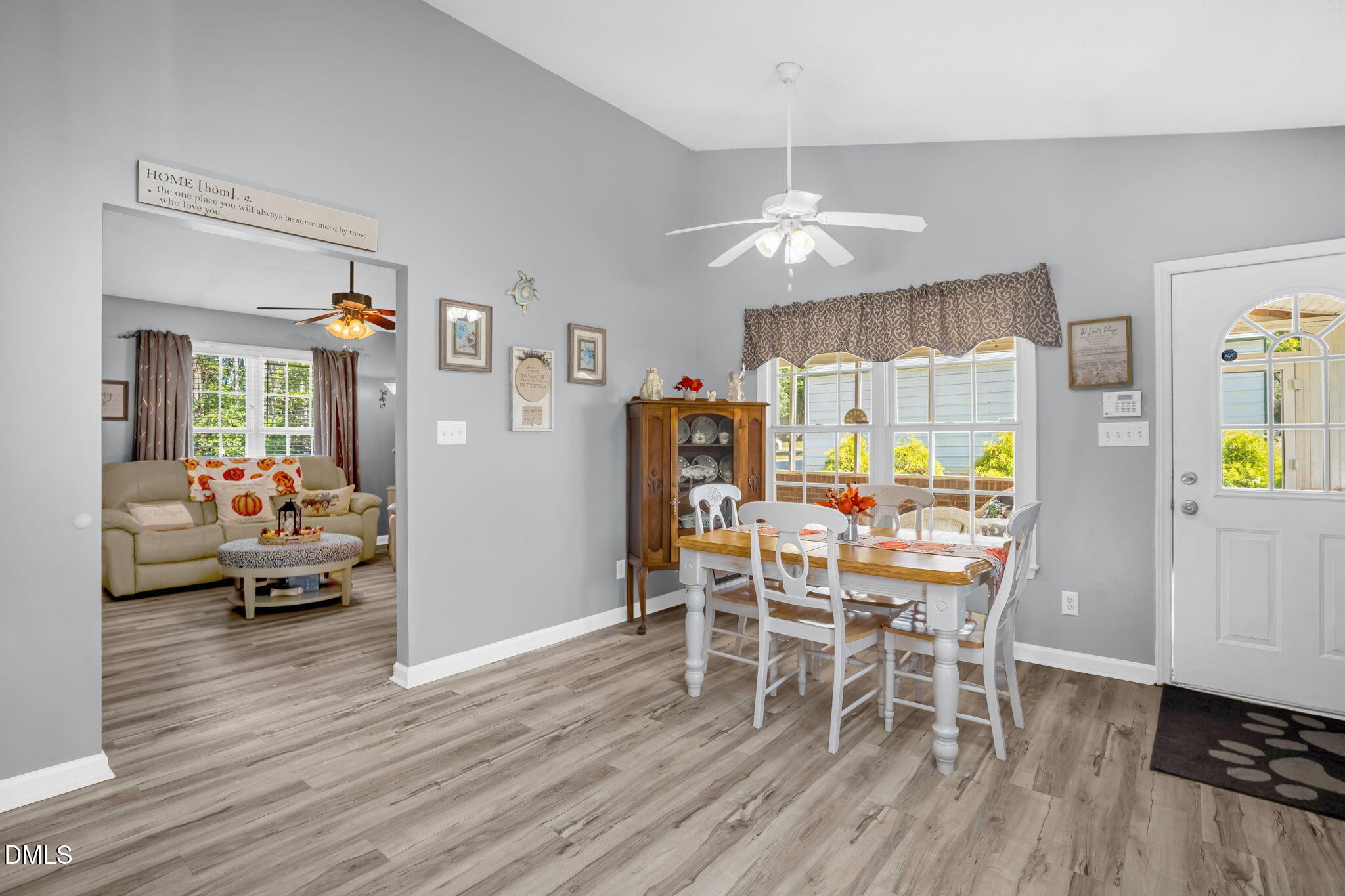 5626 Preston Loop Mebane, NC 27302 - Photo 16 of 33 a view of a dining room with furniture and wooden floor