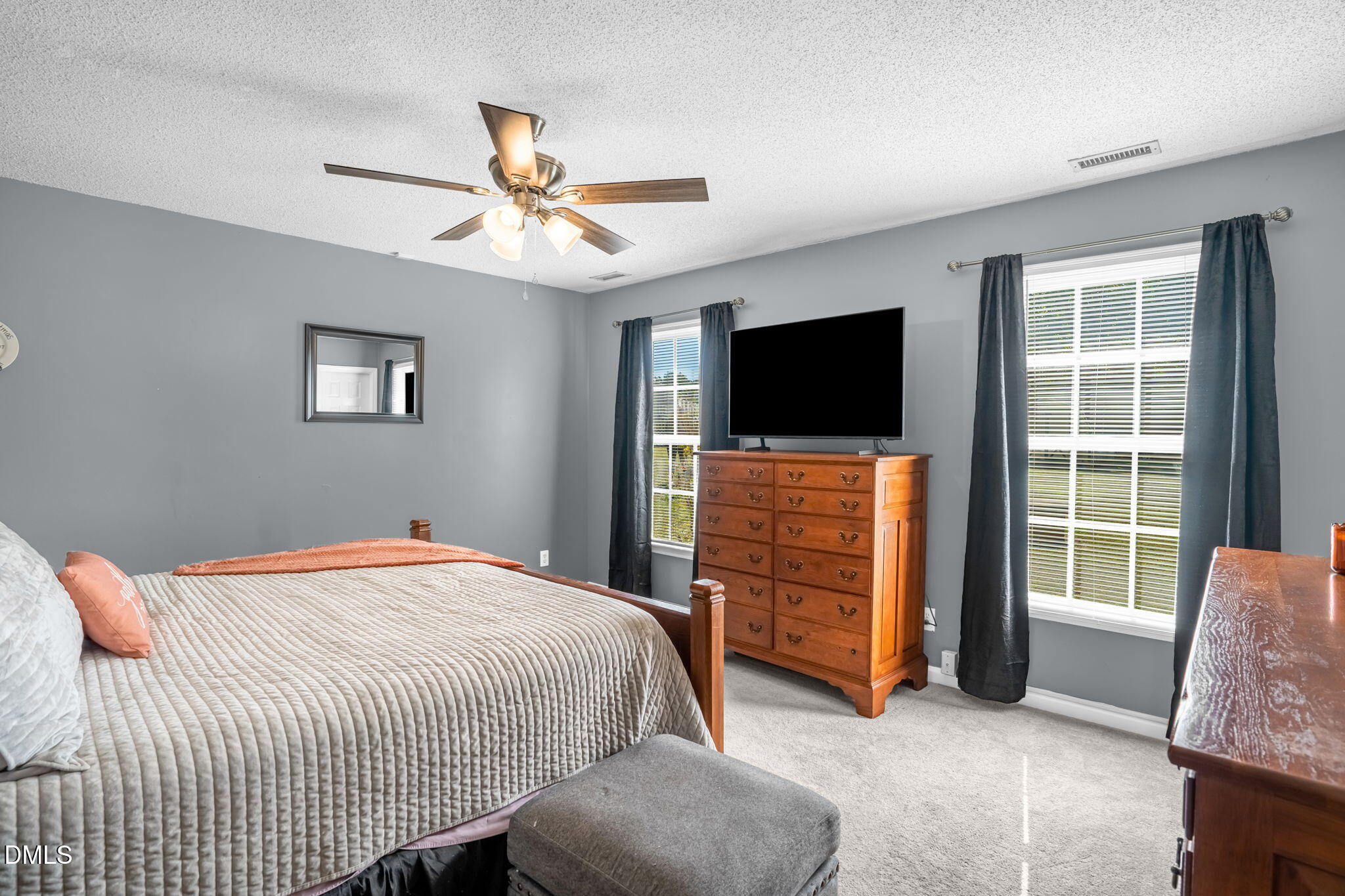 5626 Preston Loop Mebane, NC 27302 - Photo 18 of 33 a bedroom with a bed and a flat screen tv