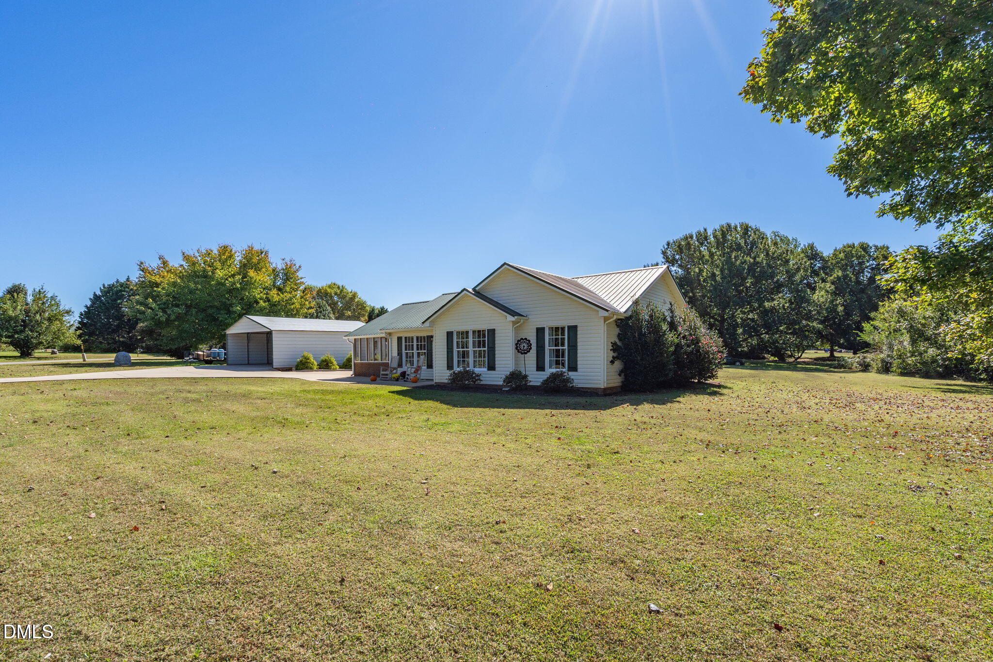 5626 Preston Loop Mebane, NC 27302 - Photo 5 of 33 a front view of a house with a garden and trees