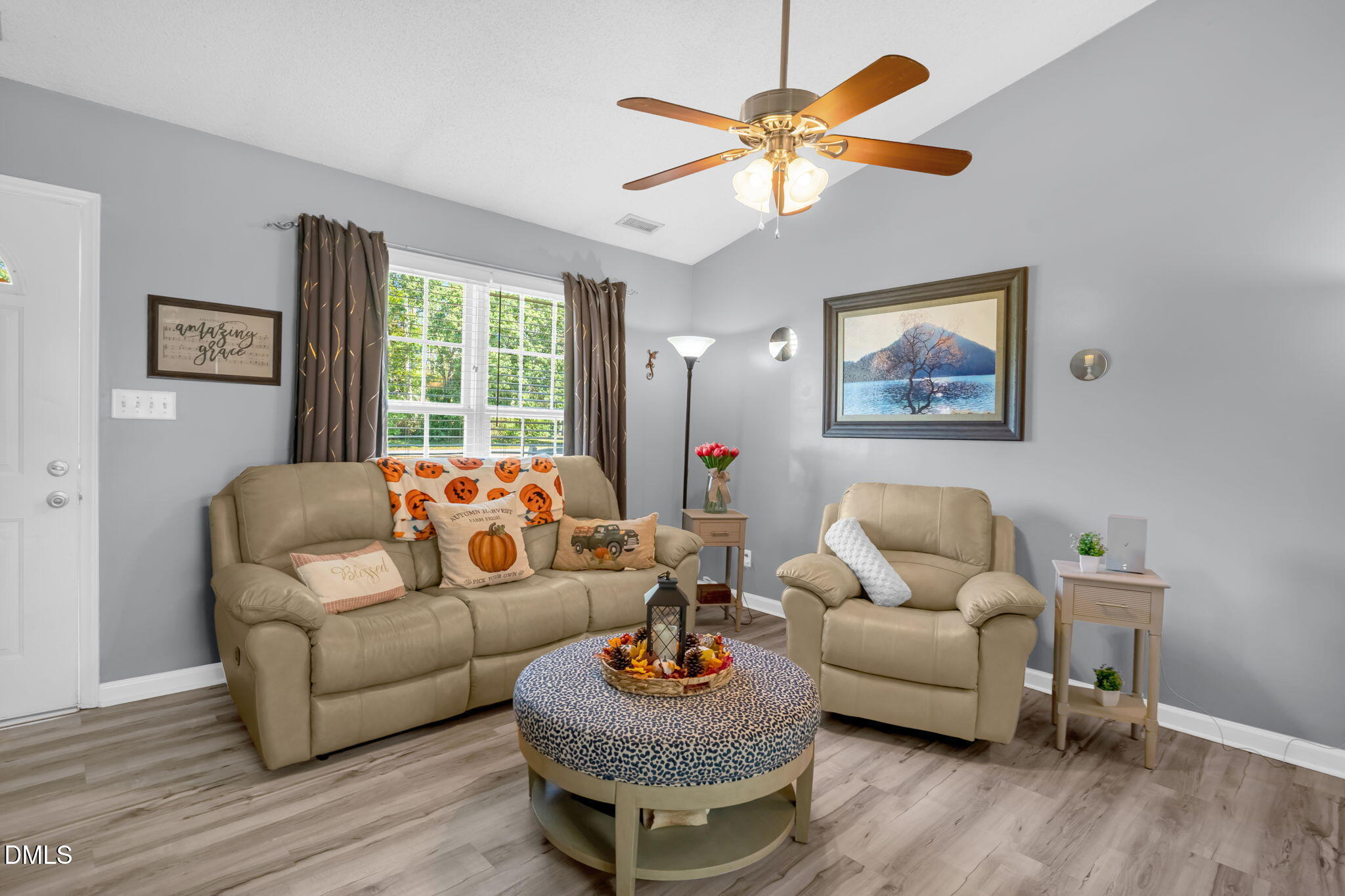 5626 Preston Loop Mebane, NC 27302 - Photo 10 of 33 a living room with furniture a chandelier and a window