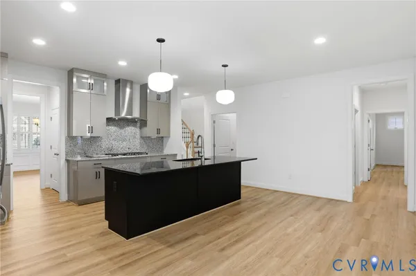 a view of a kitchen counter space and wooden floor