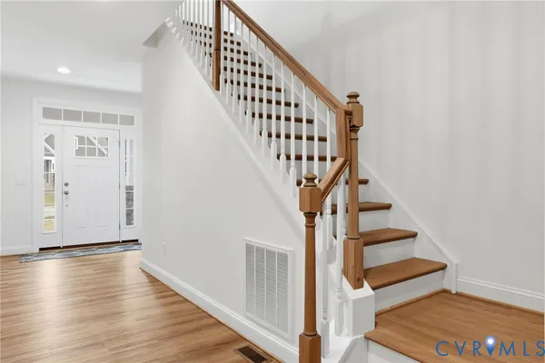 a view of entryway with wooden floor
