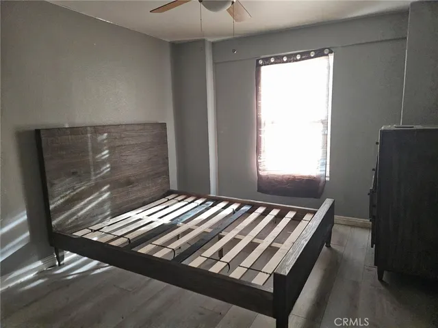 a view of room with wooden floor