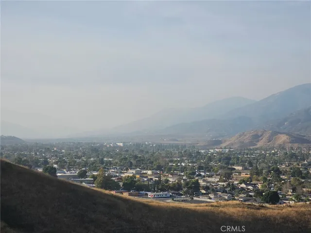 an aerial view of residential houses and city view