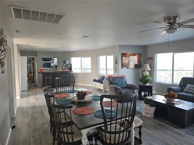 a view of a dining room with furniture and window