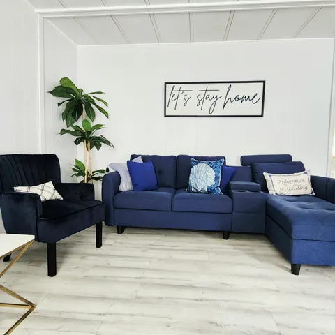 a view of a backyard with a tree