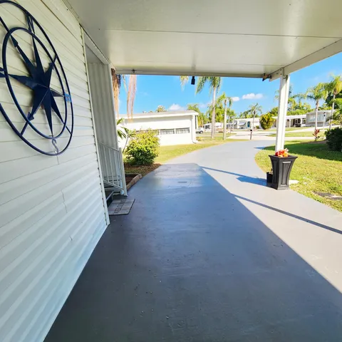 a room with a bed and a large window