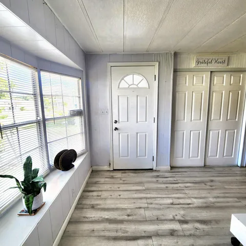 a kitchen with stainless steel appliances a refrigerator sink and microwave