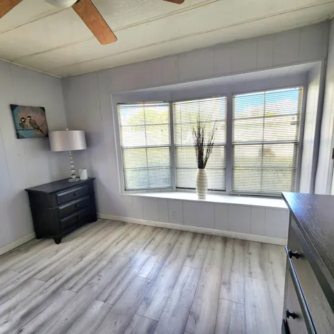 a bedroom with a bed and cabinets