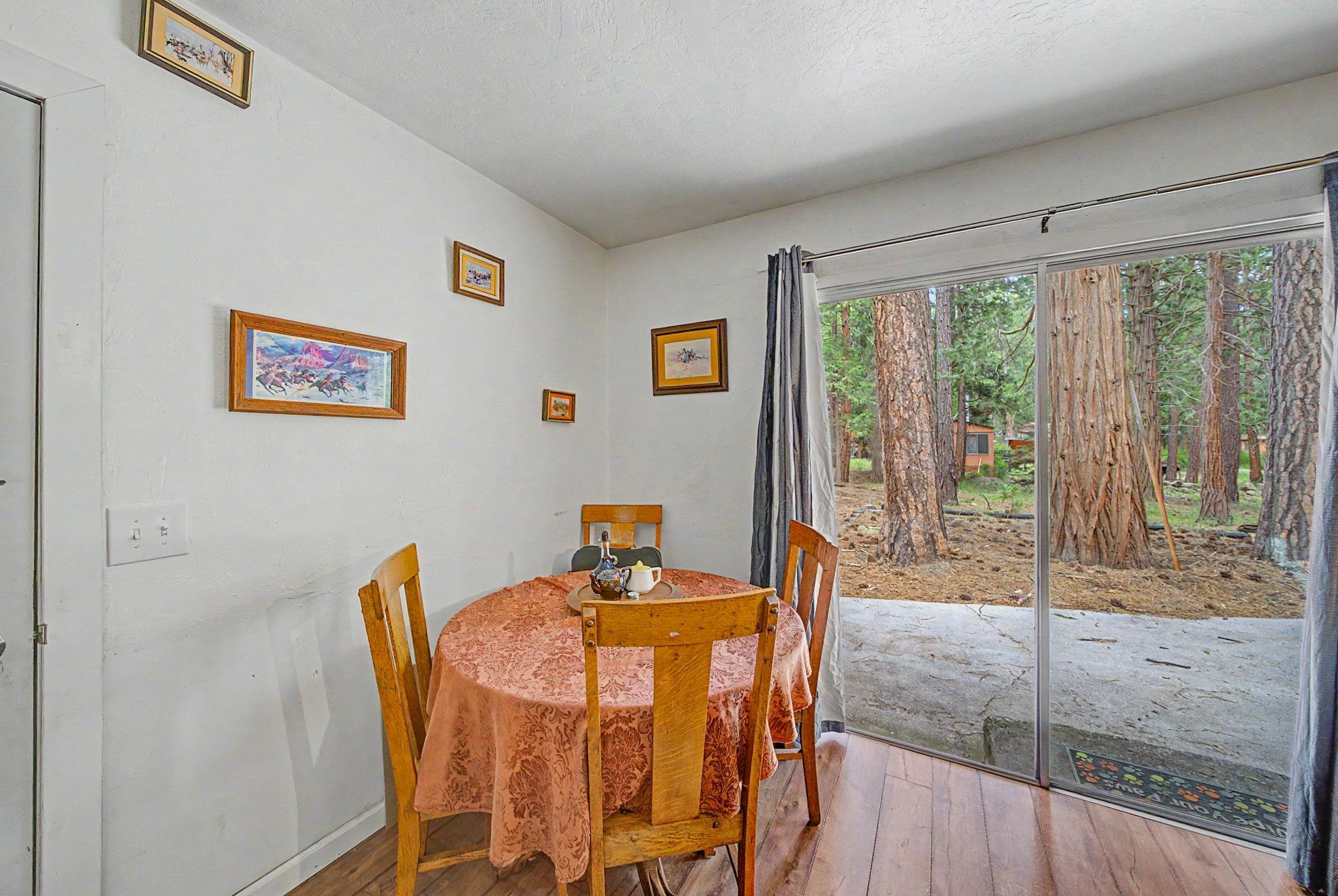 58374 Gill Ranch Road Cromberg, CA 96103 - Photo 22 of 44 a view of a dining room with furniture window and outside view